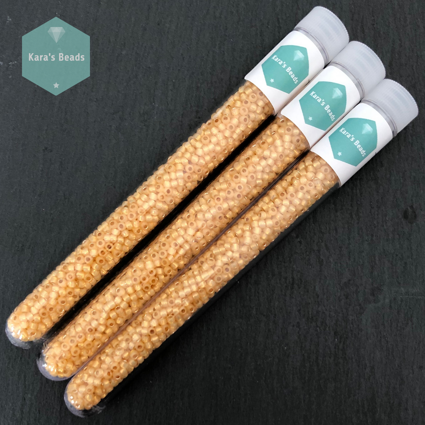 25g Tube 8/0 Toho TR8-2110 Silver Lined Milky Light Topaz