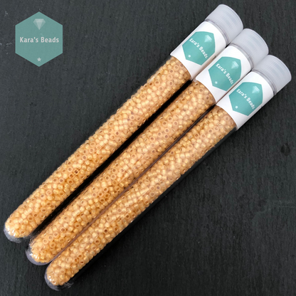 25g Tube 8/0 Toho TR8-2110 Silver Lined Milky Light Topaz