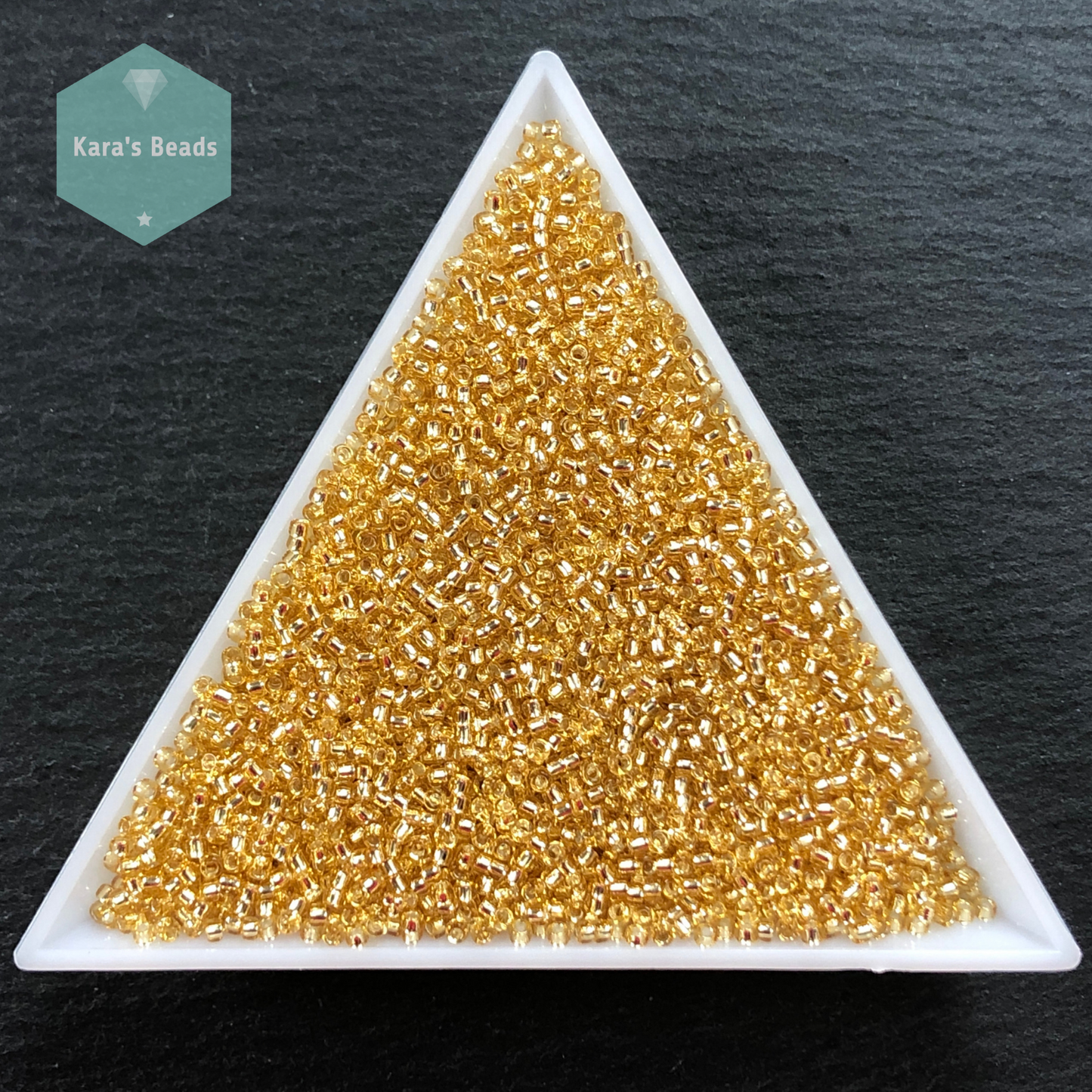 25g Tube 15/0 Toho TR15-22 Silver Lined Light Topaz