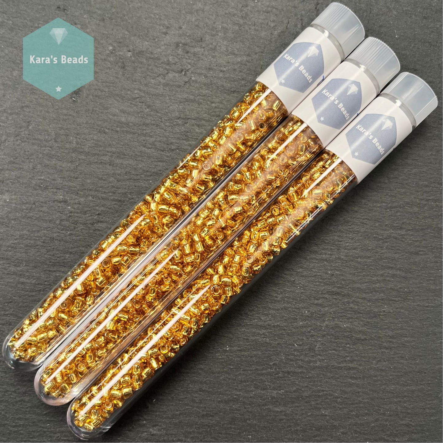 23g Tube 6/0 Toho TR6-22B Silver Lined Medium Topaz